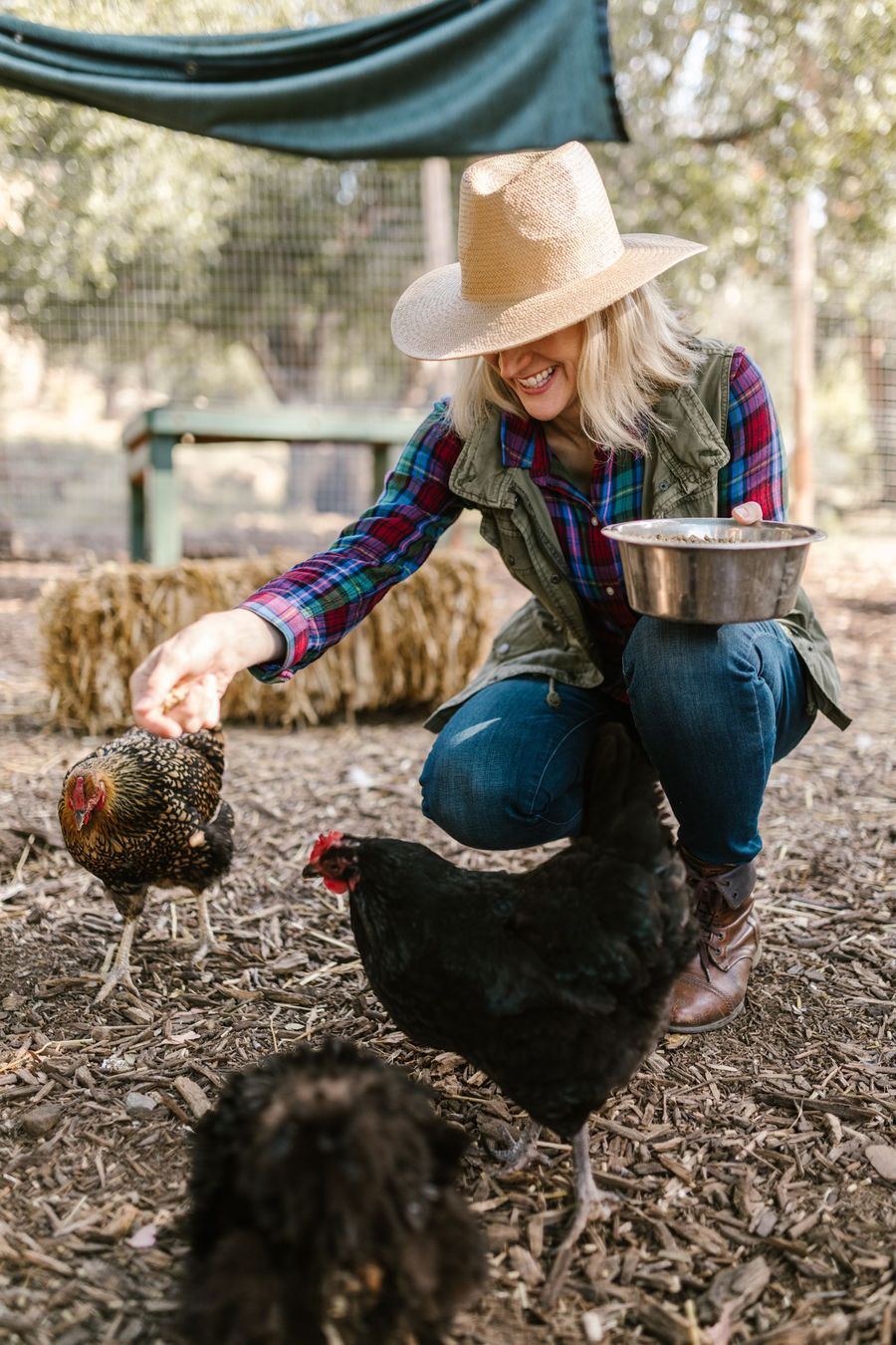 Farmer feeding her hens